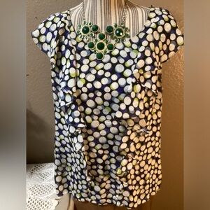 PORTRAIT OF A GIRLS POLKA DOT RUFFLE TOP